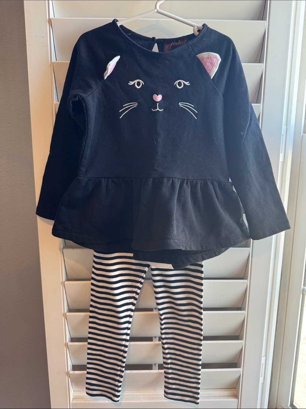 Black Cat Peplum Top and Striped Leggings outfit